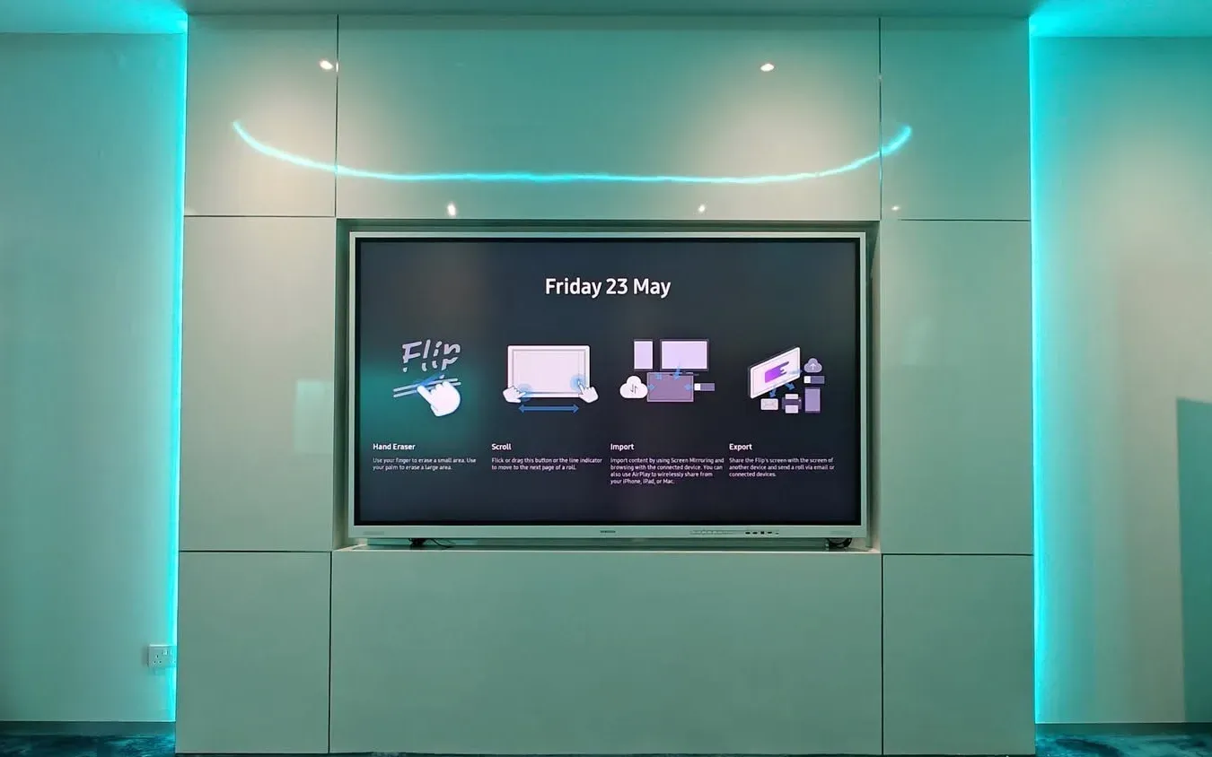 Interactive display set into a white feature wall with ambient lighting